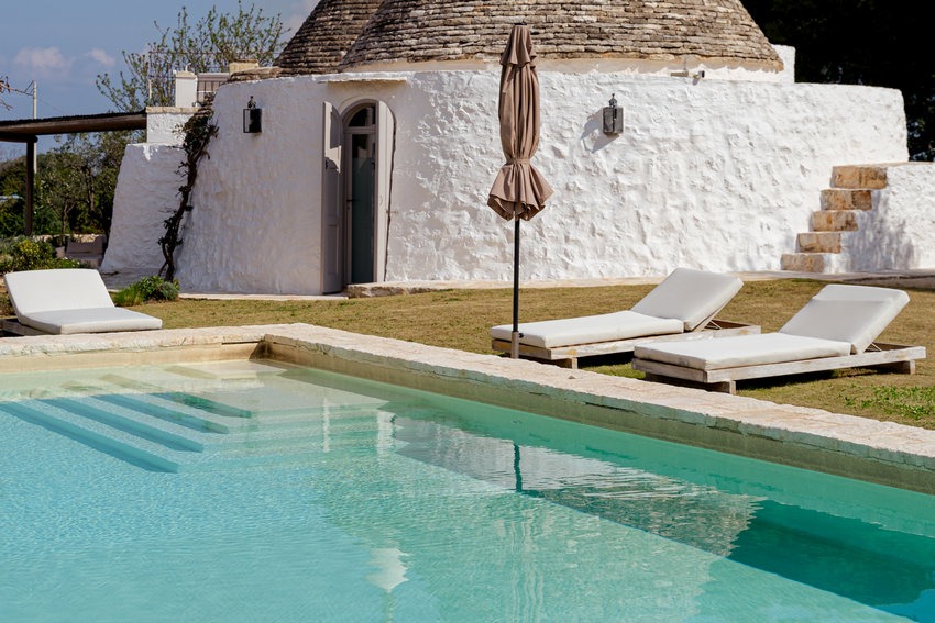 Trullo Petrarolo swimming pool with garden surroundings