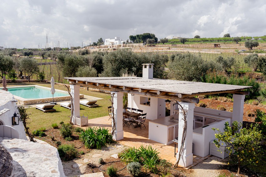 Trullo Petrarolo terrace with garden view and outdoor furniture