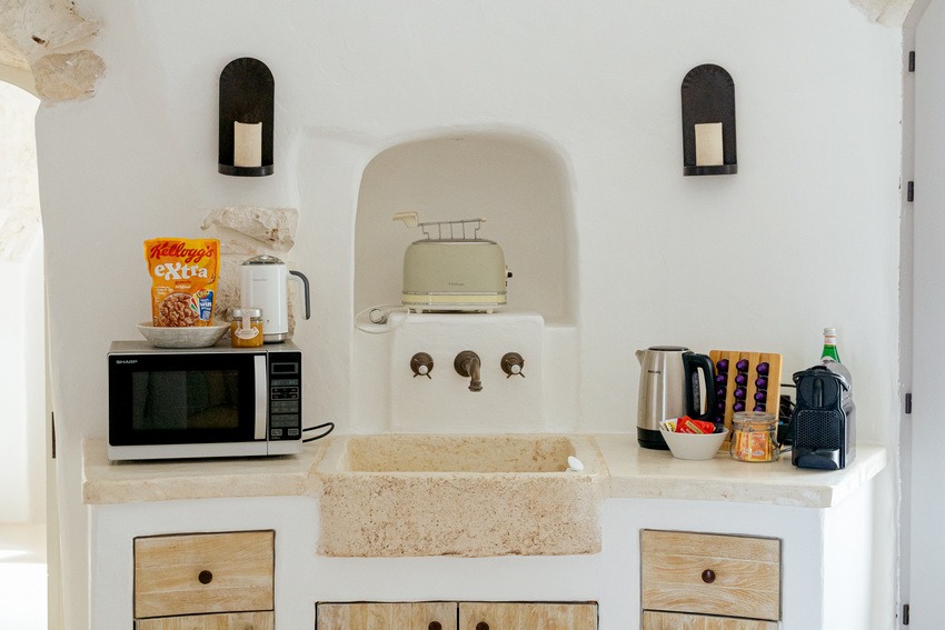 Trullo Petrarolo kitchen with and compact appliance setup