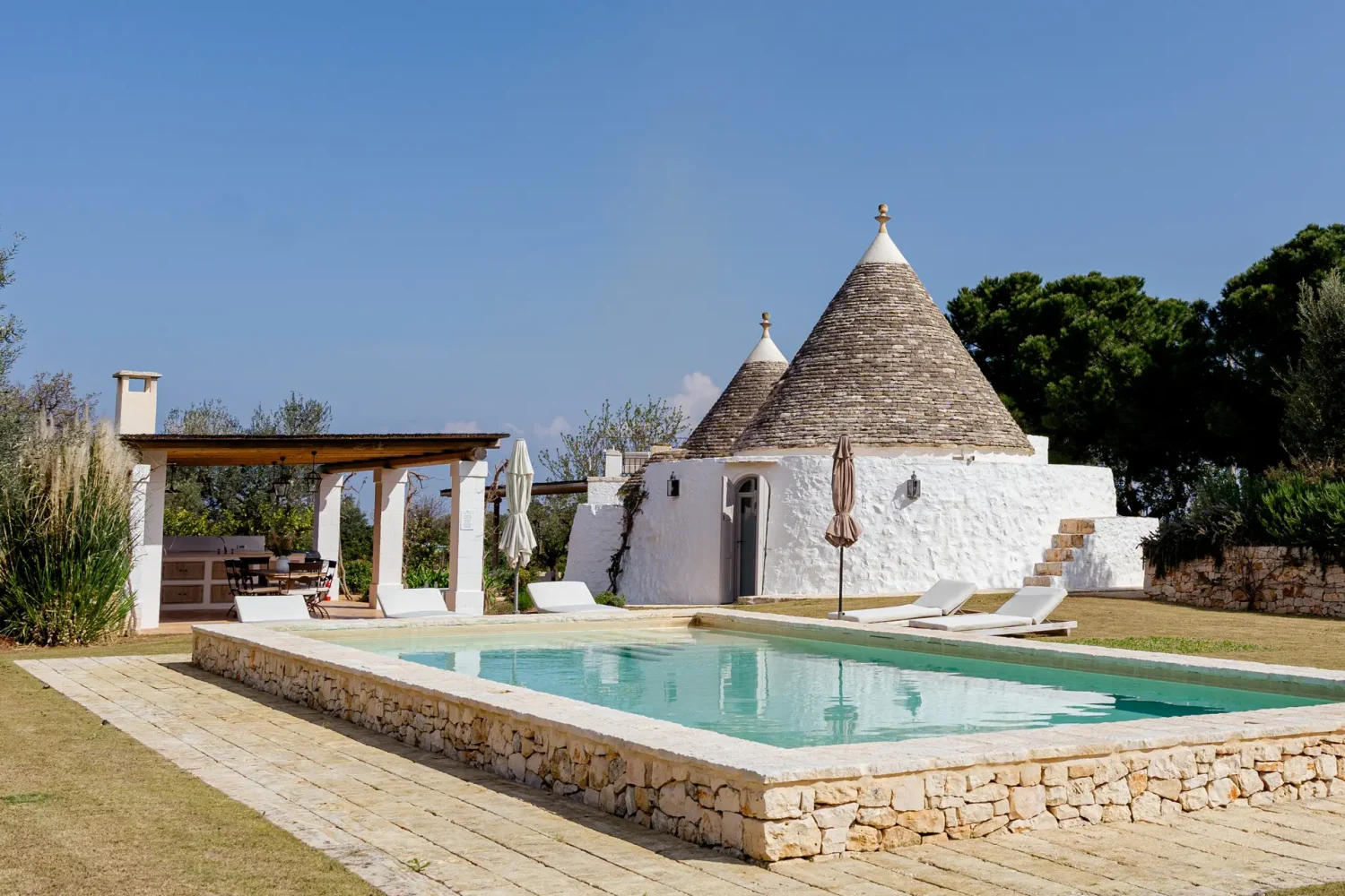 The private swimming pool at Trullo Petrarolo · 1