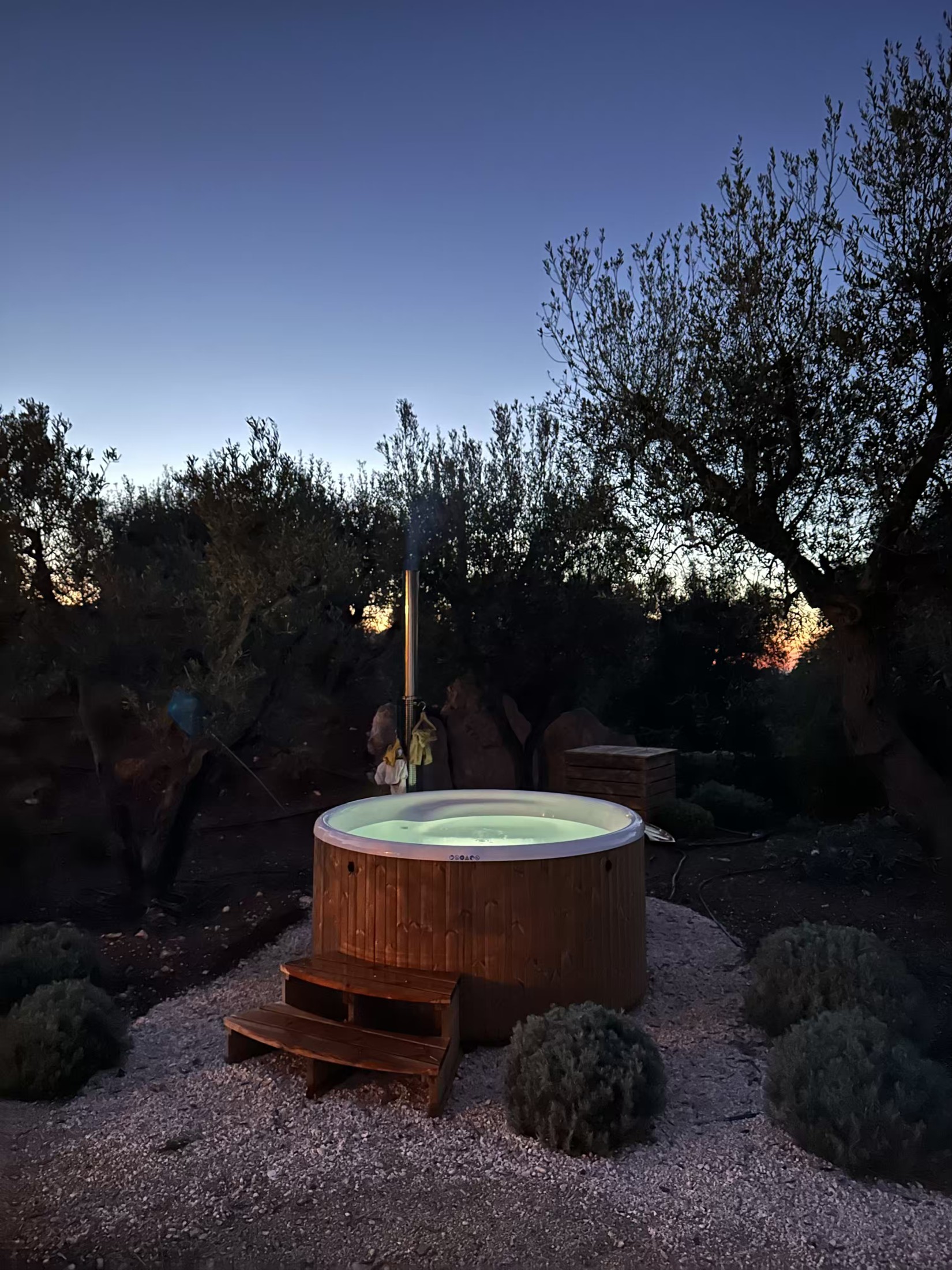 The illuminated hot tub at dusk